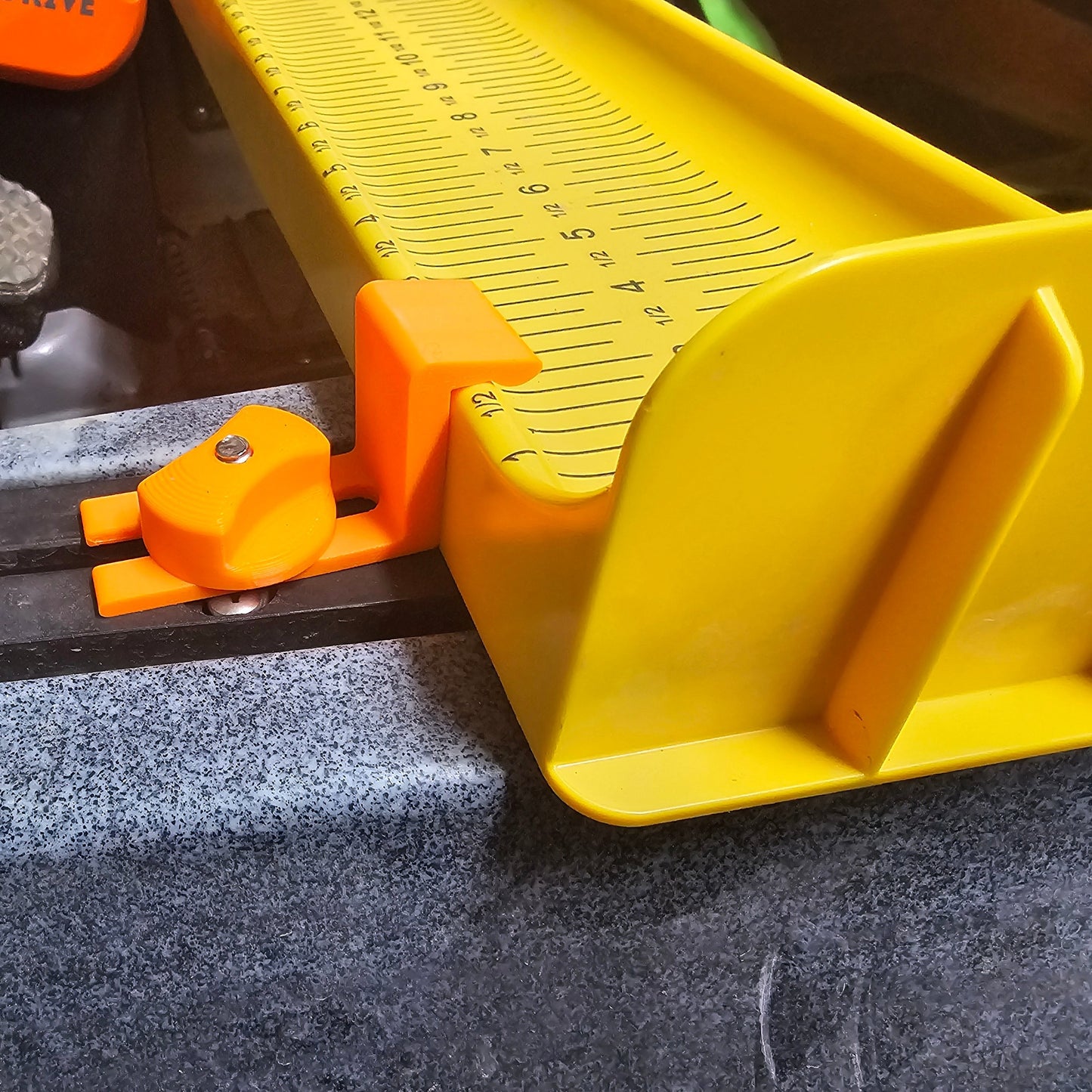 ketck klip installed on rail with included knob holding a board