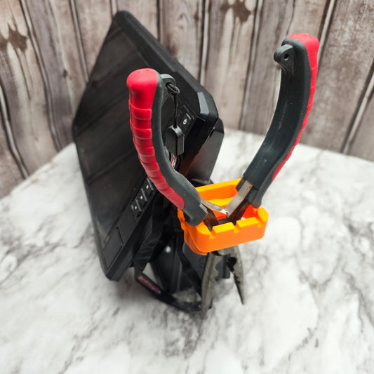 Side view of the chartplotter tool holder holding pliers