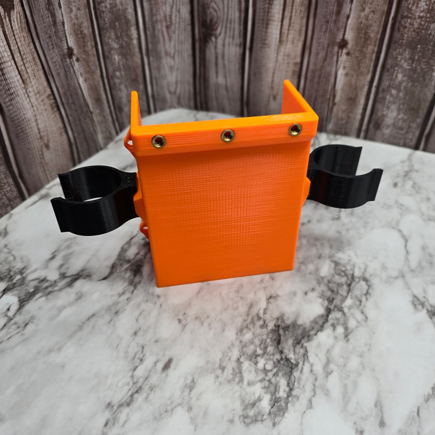Photo of the small accessory pocket with two can clips installed