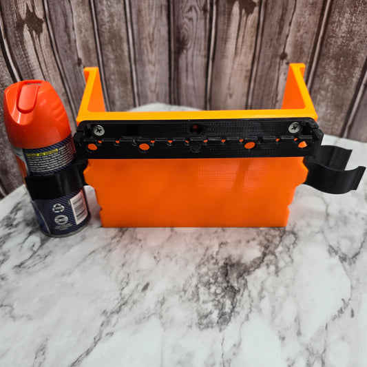 Photo of the large pocket with clips and lure hanger and holding a can of bug spray