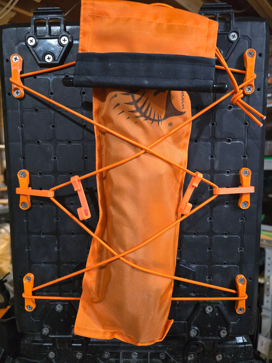 Padeye kit holding an orange pouch