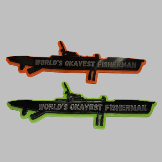 Two kayak magnets, one orange and one green