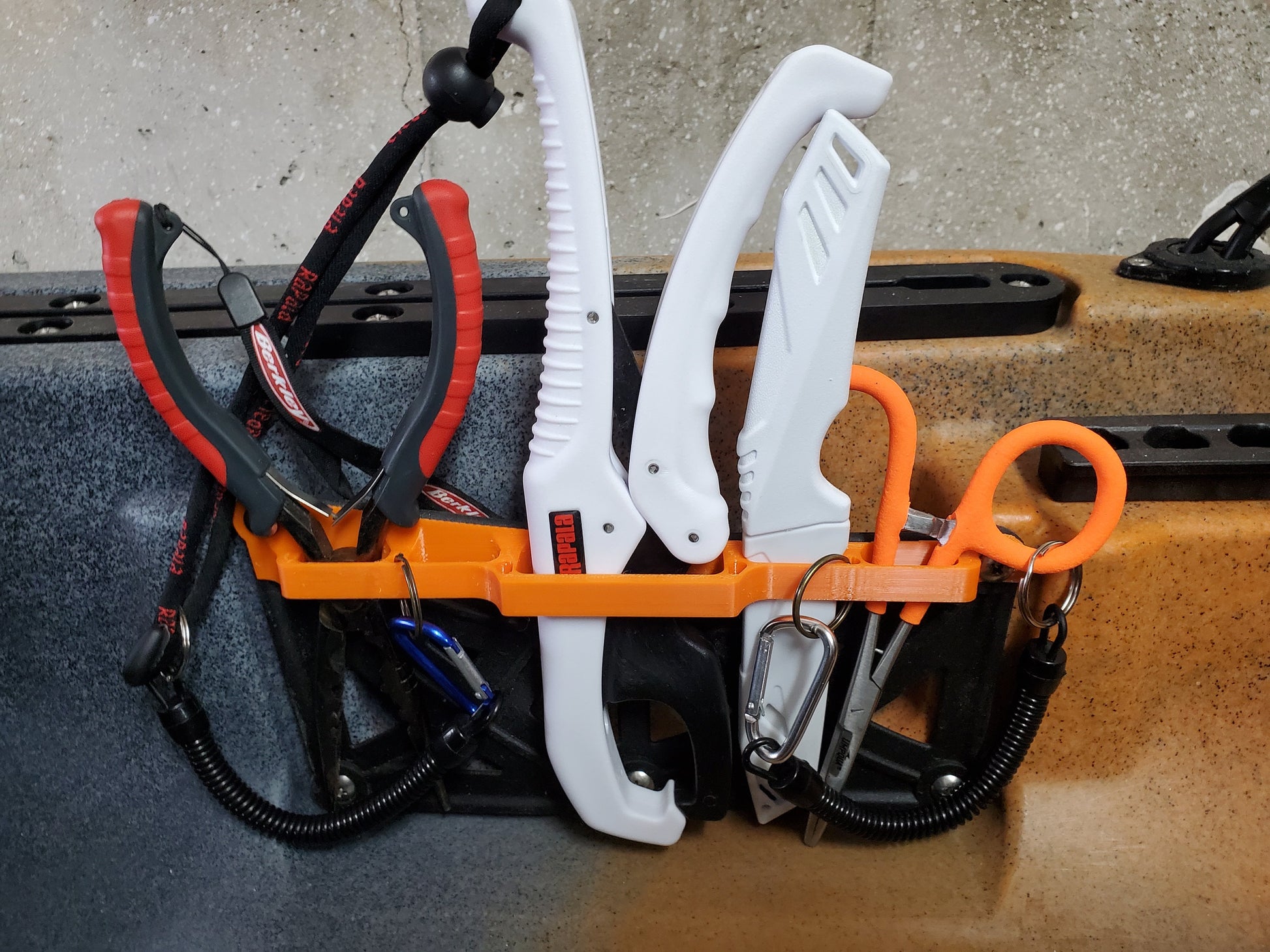 Photo of tool holder mounted on kayak holding tools