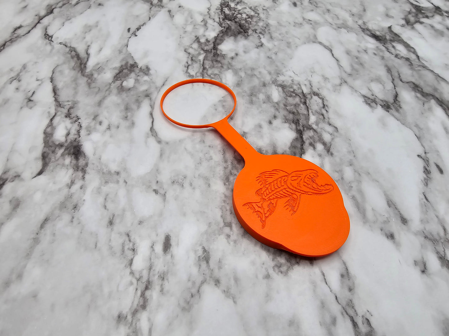 Photo of a single, orange can cover