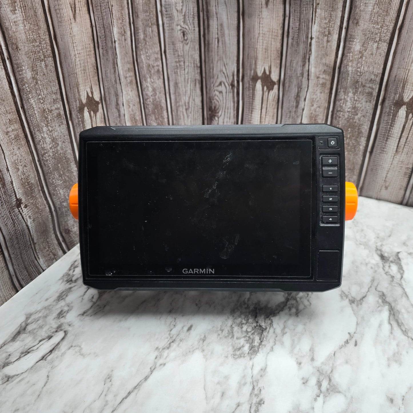 Photo of a chartplotter with two custom knobs