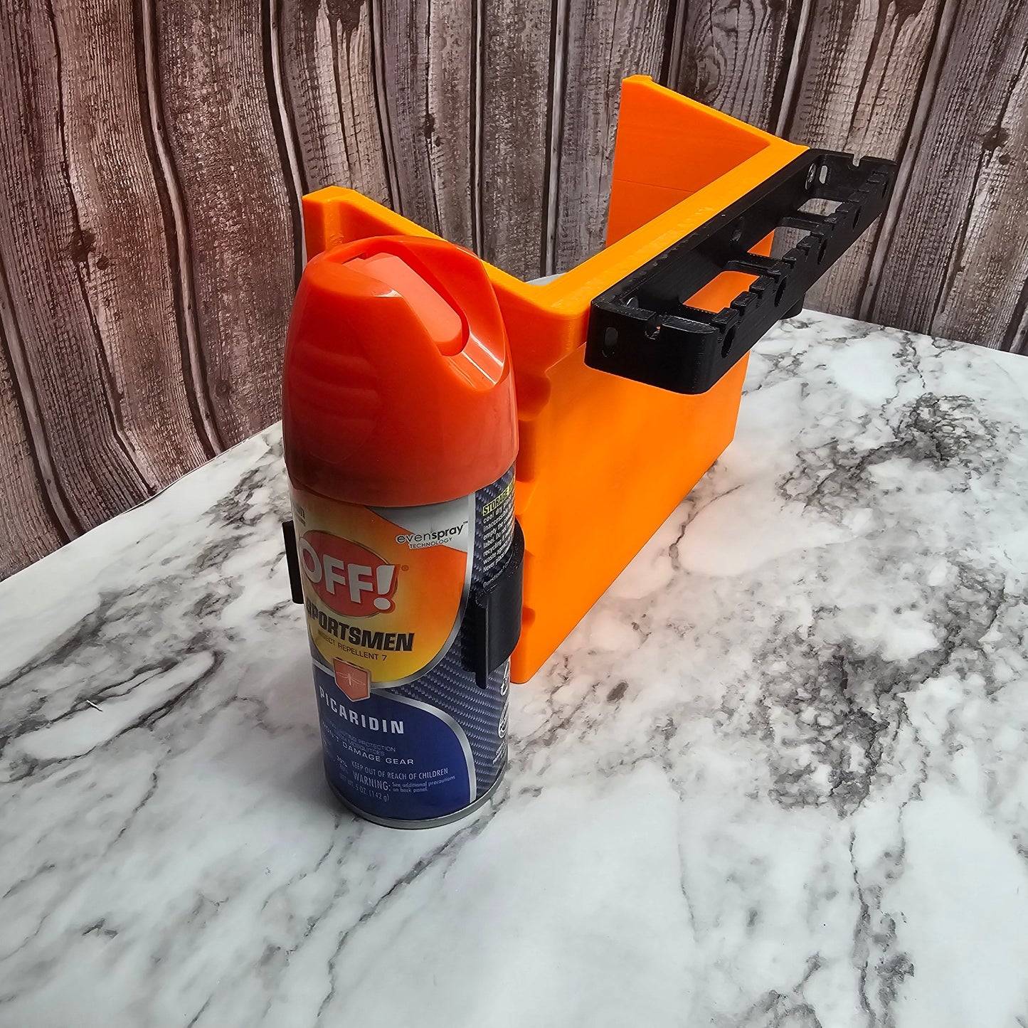 Photo of the side of the large pocket holding a can of bug spray