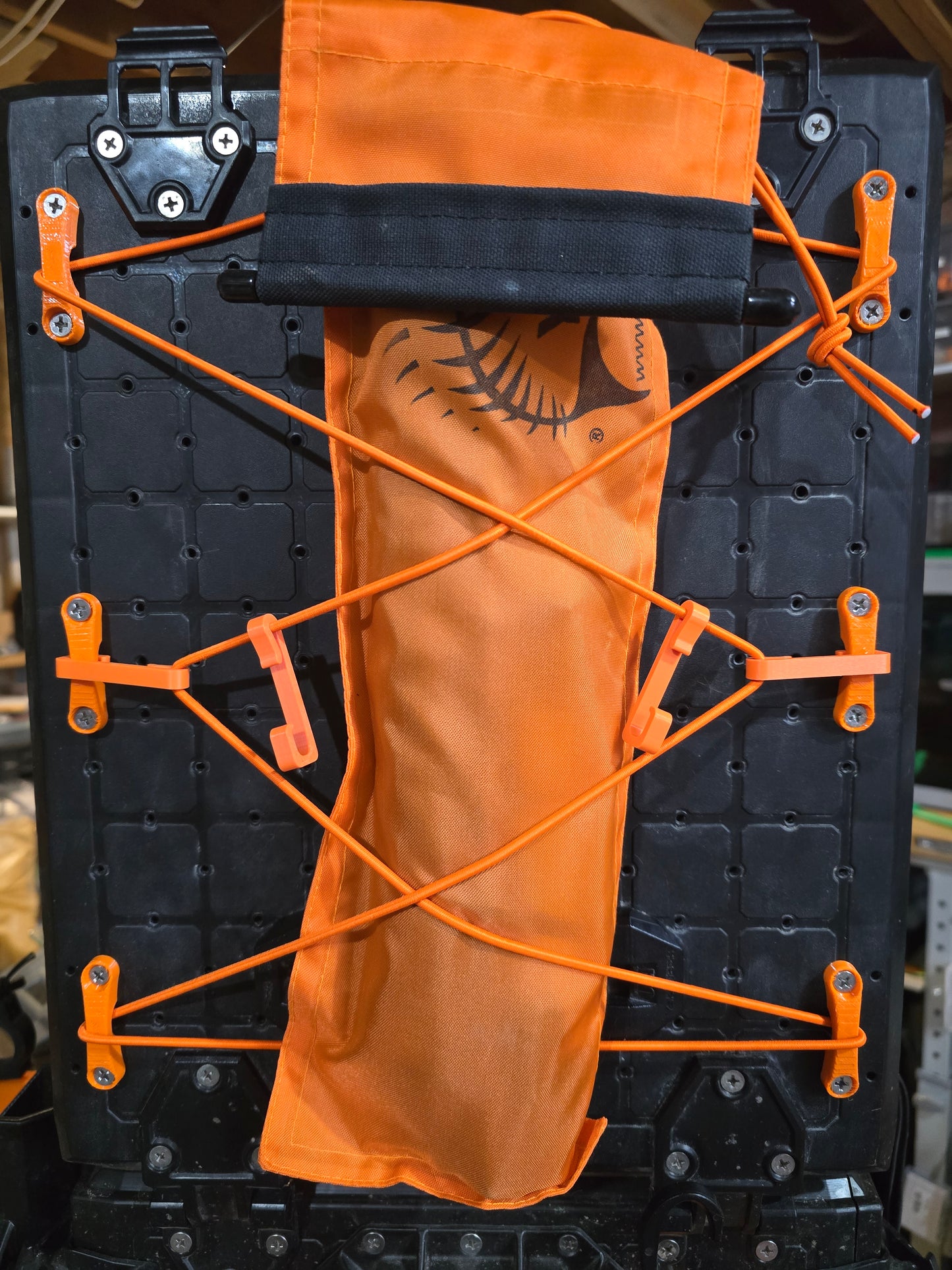 Padeye kit holding an orange pouch