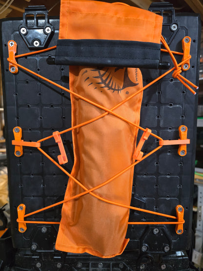 Padeye kit holding an orange pouch