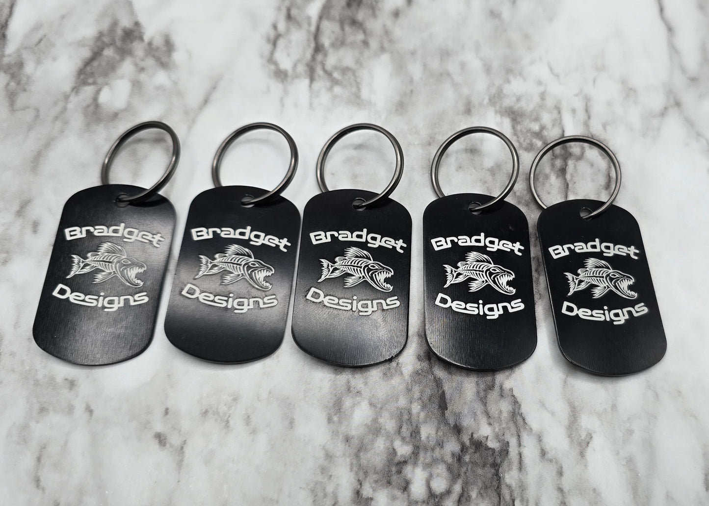 five black split rigs with bradget designs logo