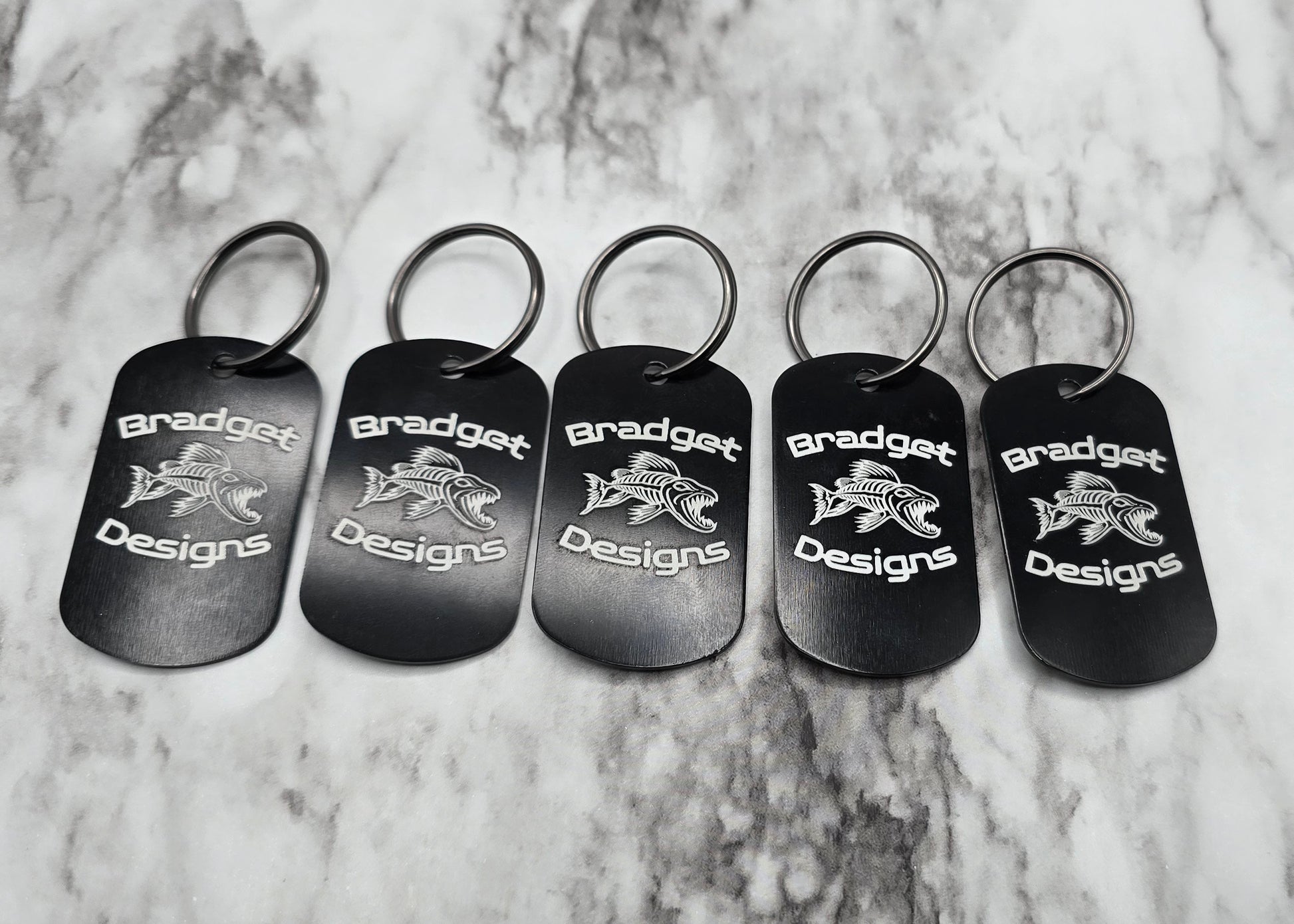 five black split rigs with bradget designs logo