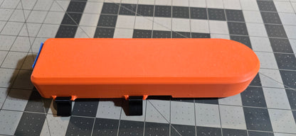 Orange and black transducer cover on a grid background