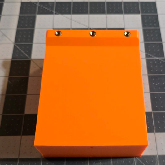 Orange rectangular object on a grid surface