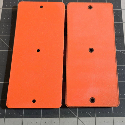 Two slot mounts on a grid background