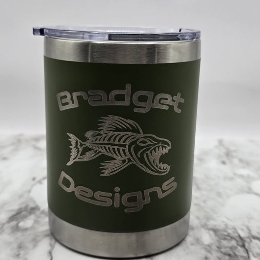 Green tumbler with silver lid on a marble surface, featuring 'Bradget Designs' branding.