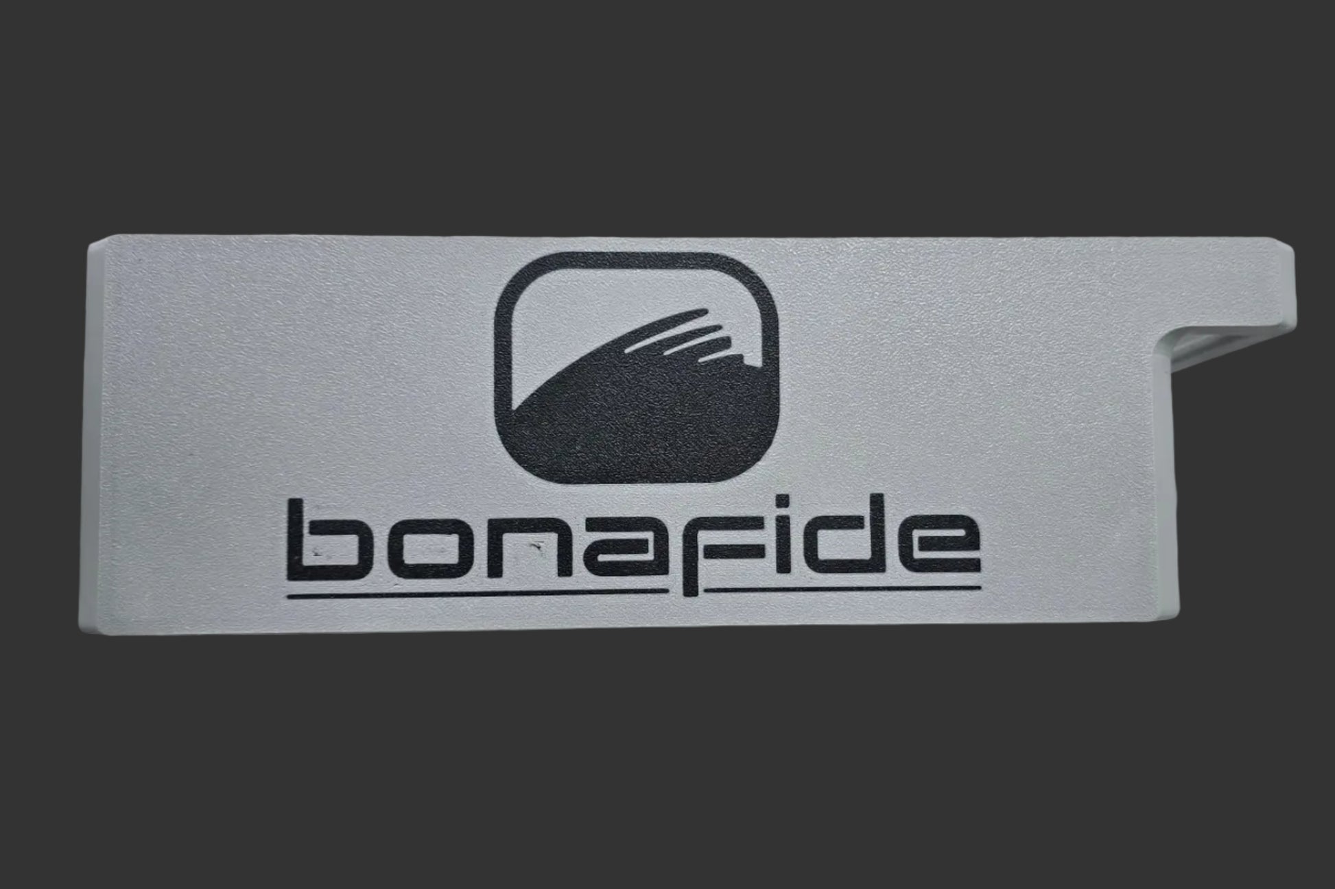 Gray sunshade with 'bonafide' logo on a marble surface