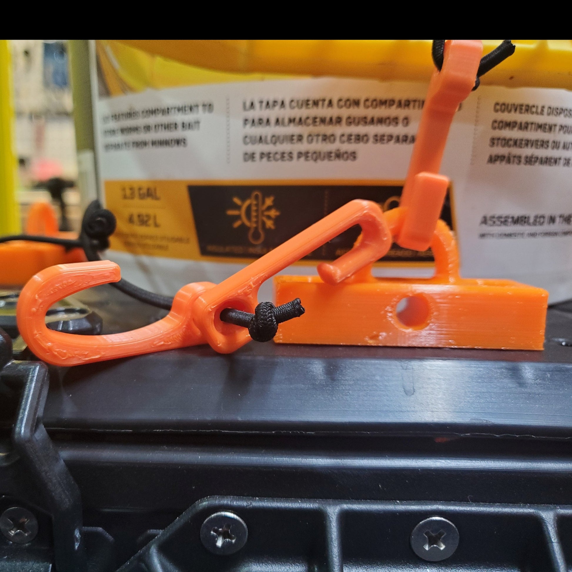 Image showing the installed hook base holding a bait bucket on a blackpak