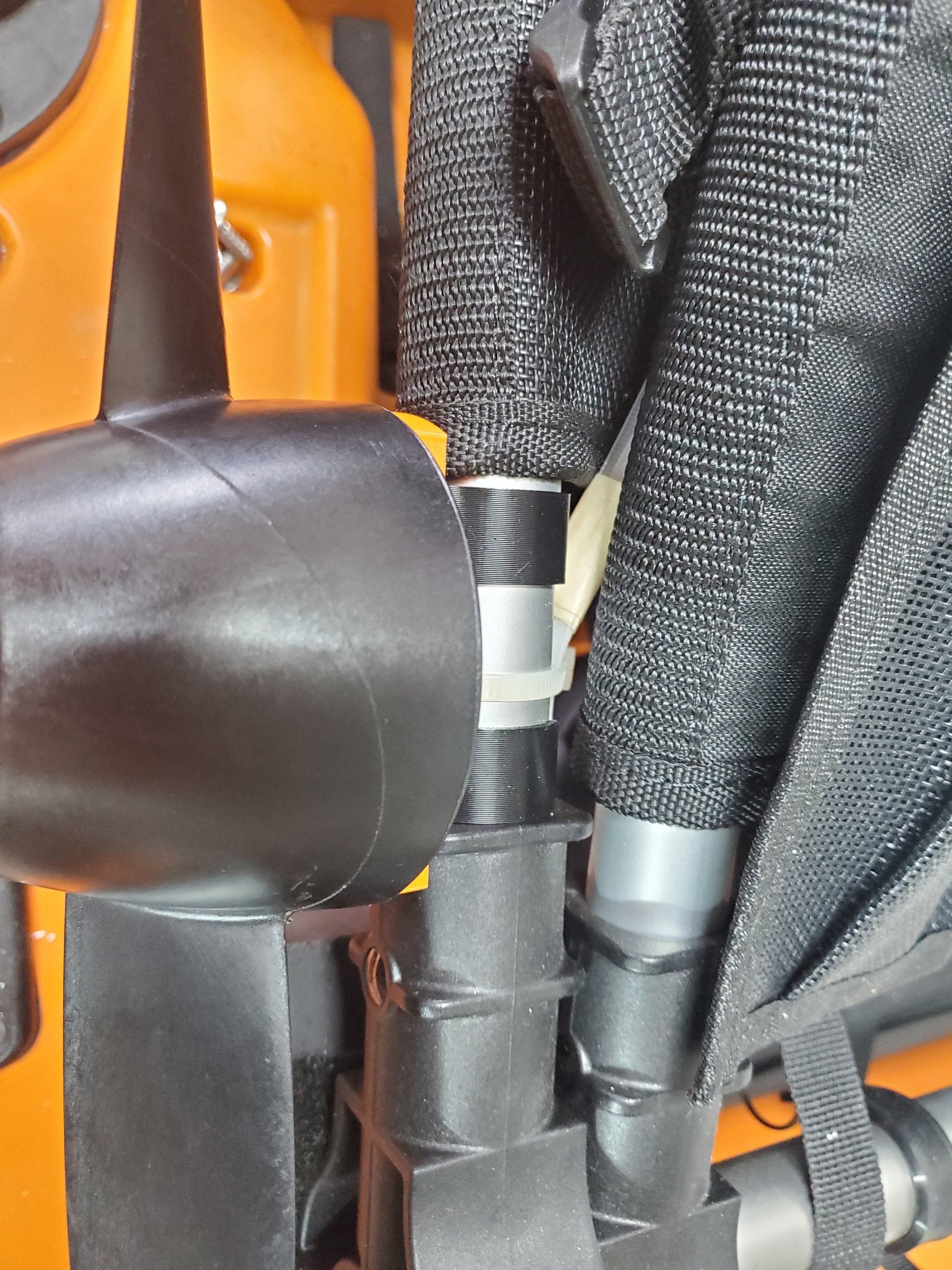 Photo of the prop mount clipped on the side of the Old Town seat