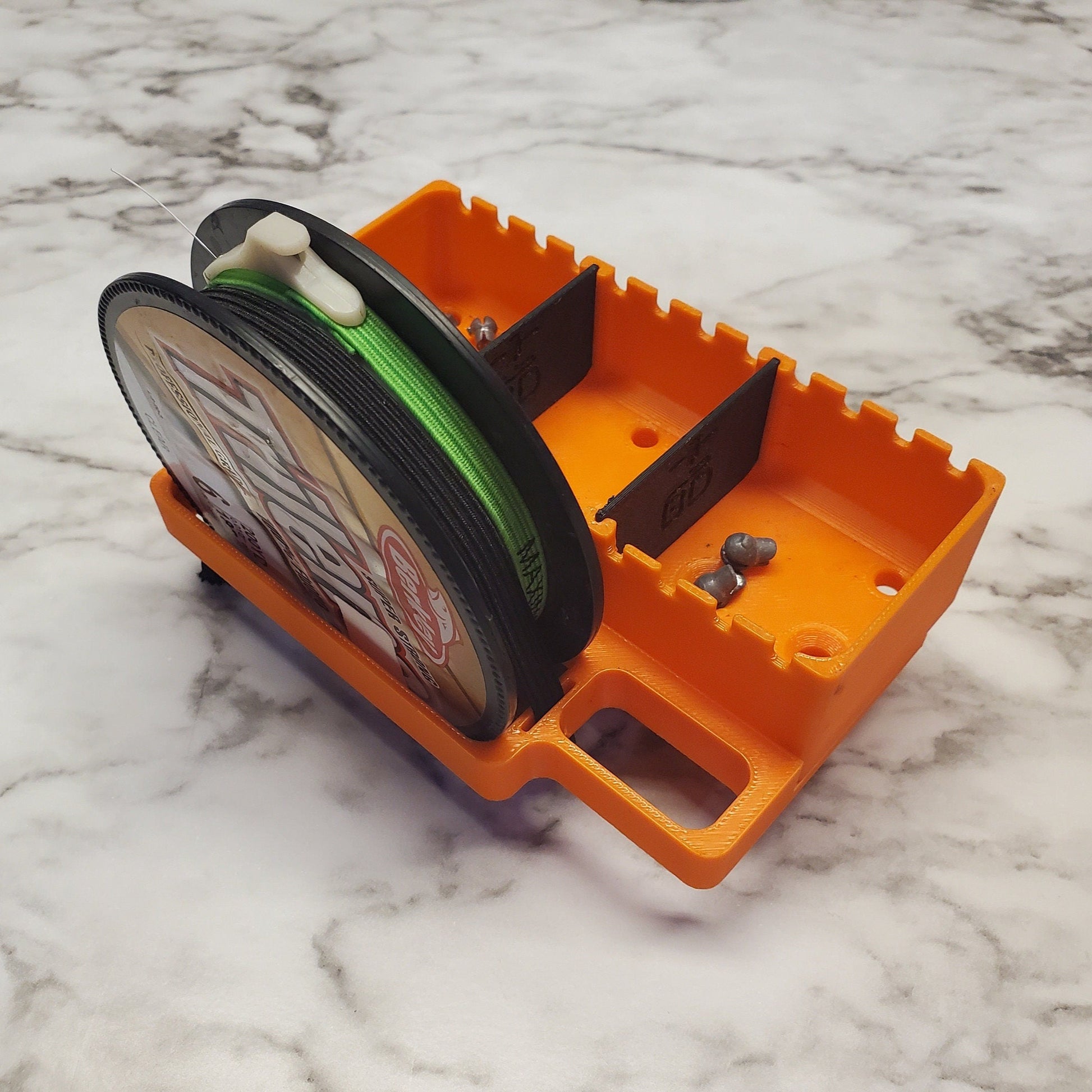 Image of the small spool holder holding a spool of fishing line