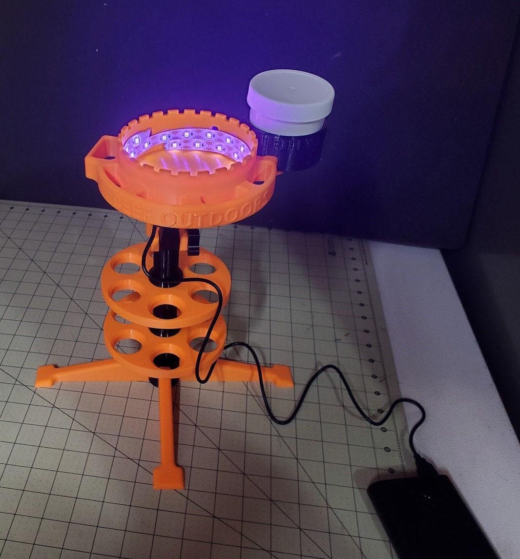Photo of a shack caddy with an ultraviolet glow cup