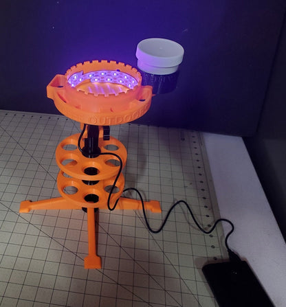 Photo of a shack caddy with an ultraviolet glow cup
